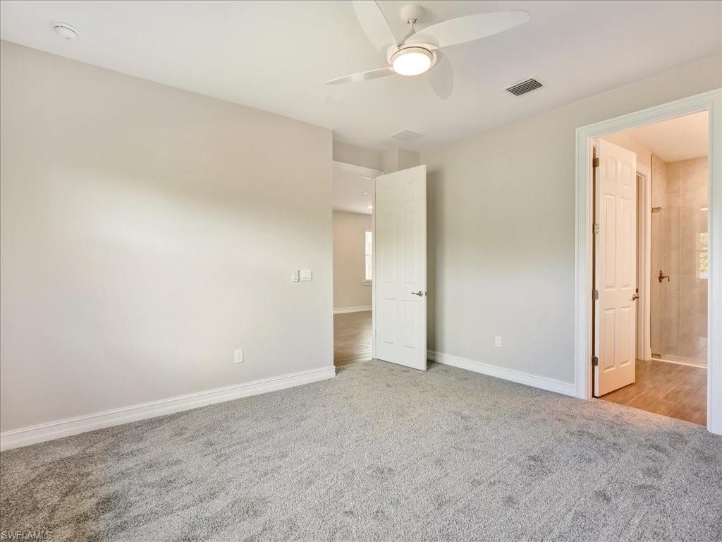 999 Enbrook Loop Naples, FL 34114 - Photo 22 of 50 an empty room with a bathroom