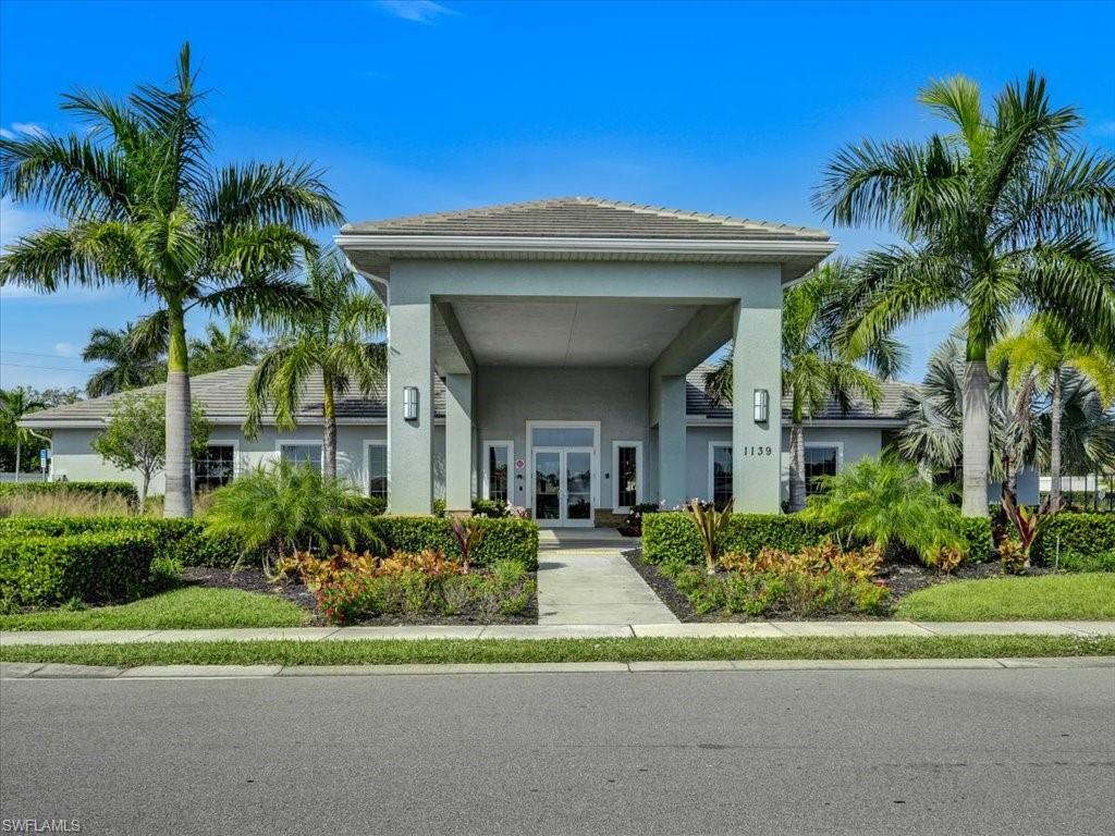 999 Enbrook Loop Naples, FL 34114 - Photo 45 of 50 a front view of a house with a yard