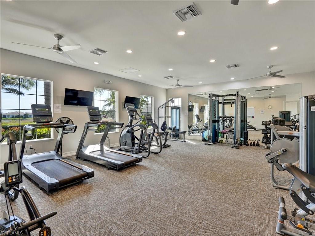 999 Enbrook Loop Naples, FL 34114 - Photo 48 of 50 a view of a room with gym equipment
