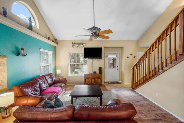 a living room with furniture and a flat screen tv