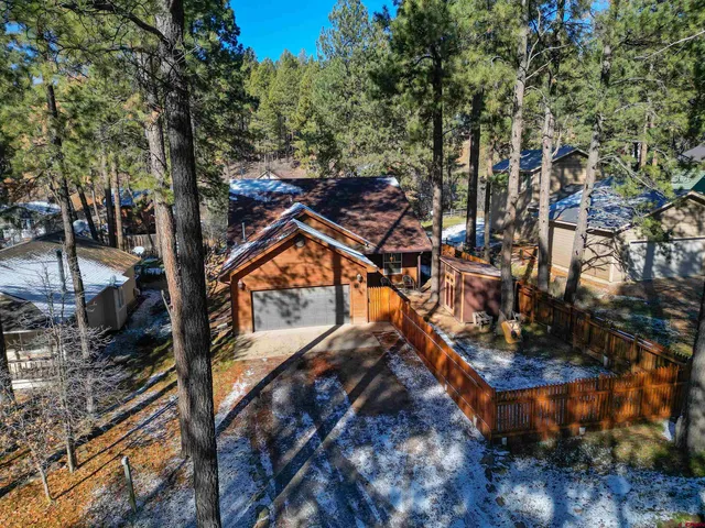 a view of a house with a tree