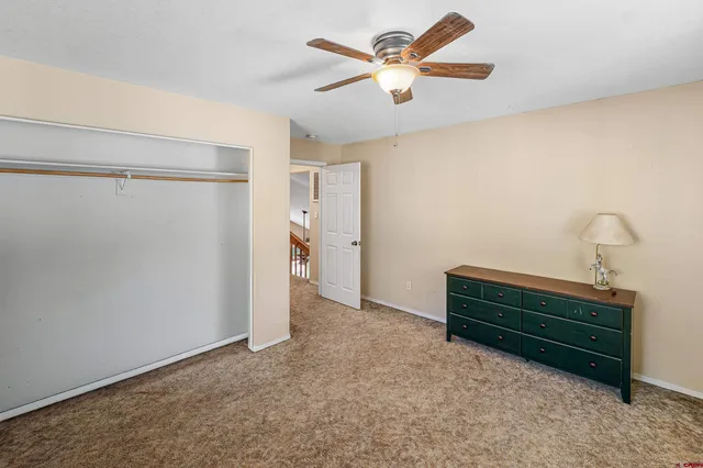 a view of room with a projector and fan