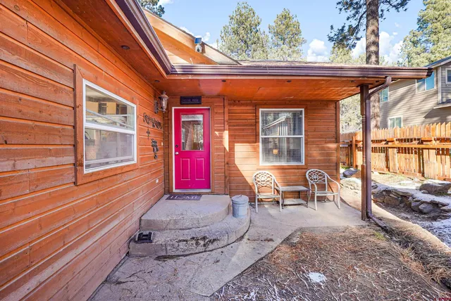 a view of a backyard with sitting area and furniture