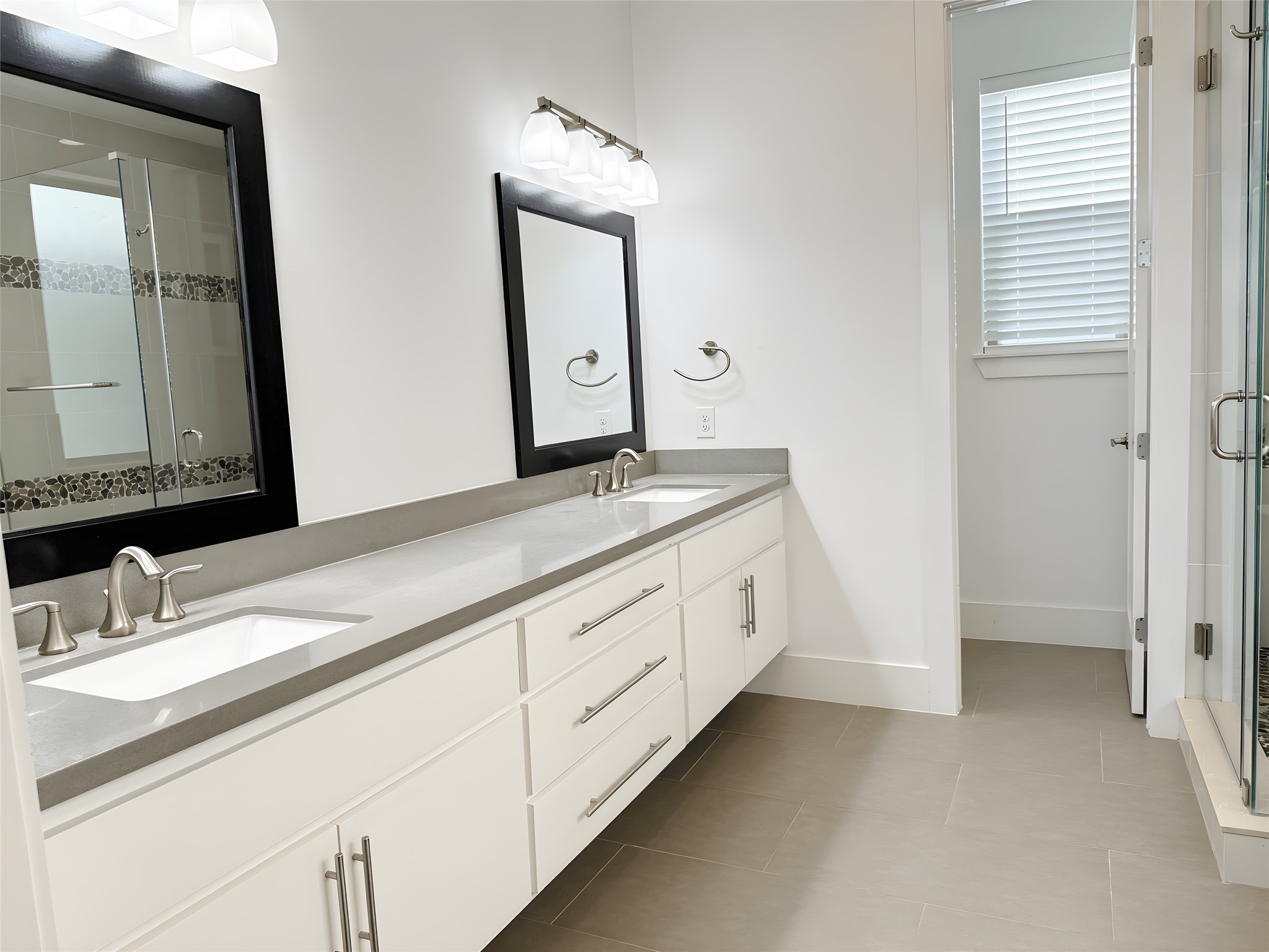 2115 Detering Street Houston, TX 77007 - Photo 17 of 30 a bathroom with a granite countertop sink vanity and mirror