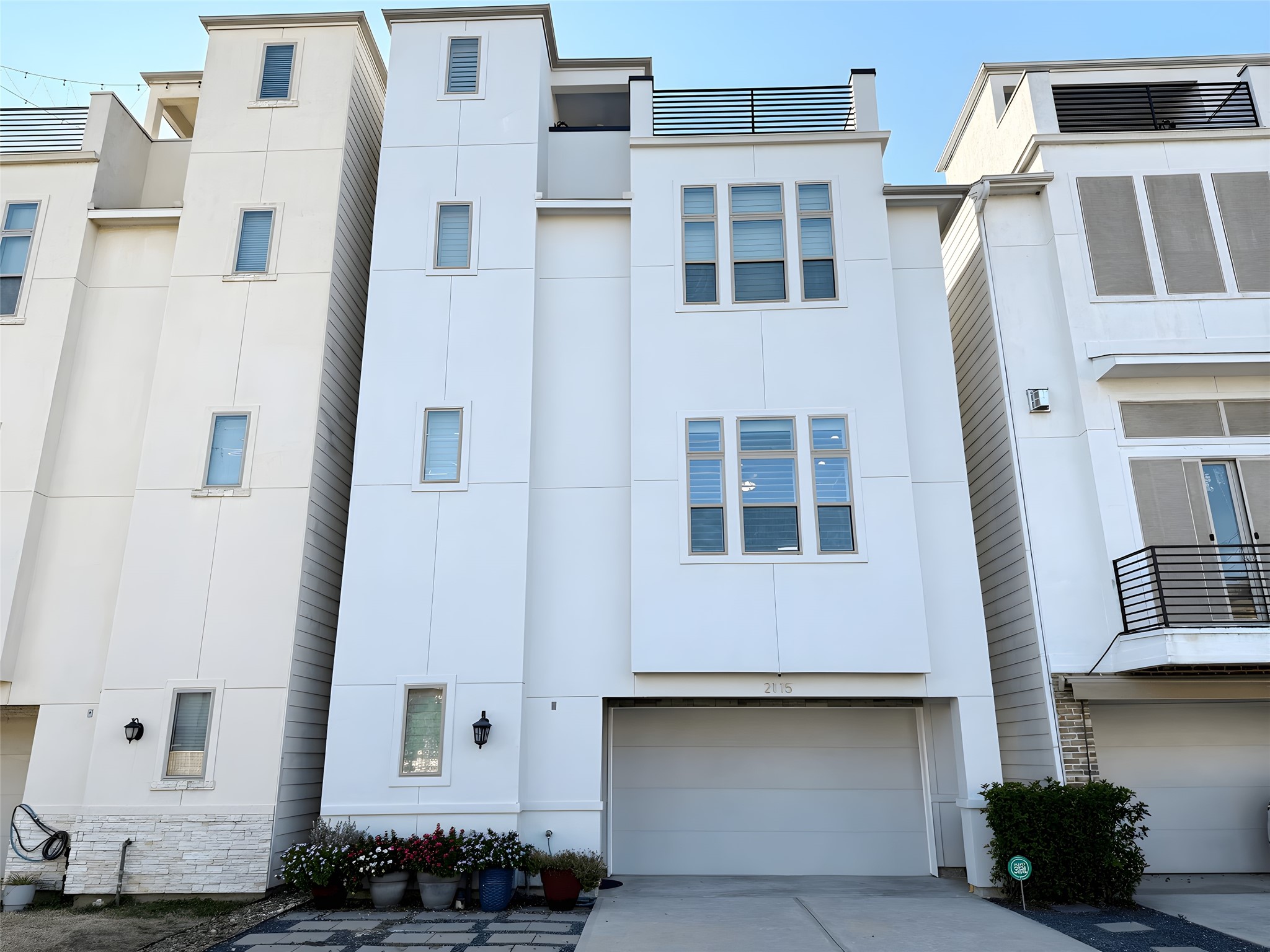 2115 Detering Street Houston, TX 77007 - Photo 2 of 30 a front view of a building with balcony