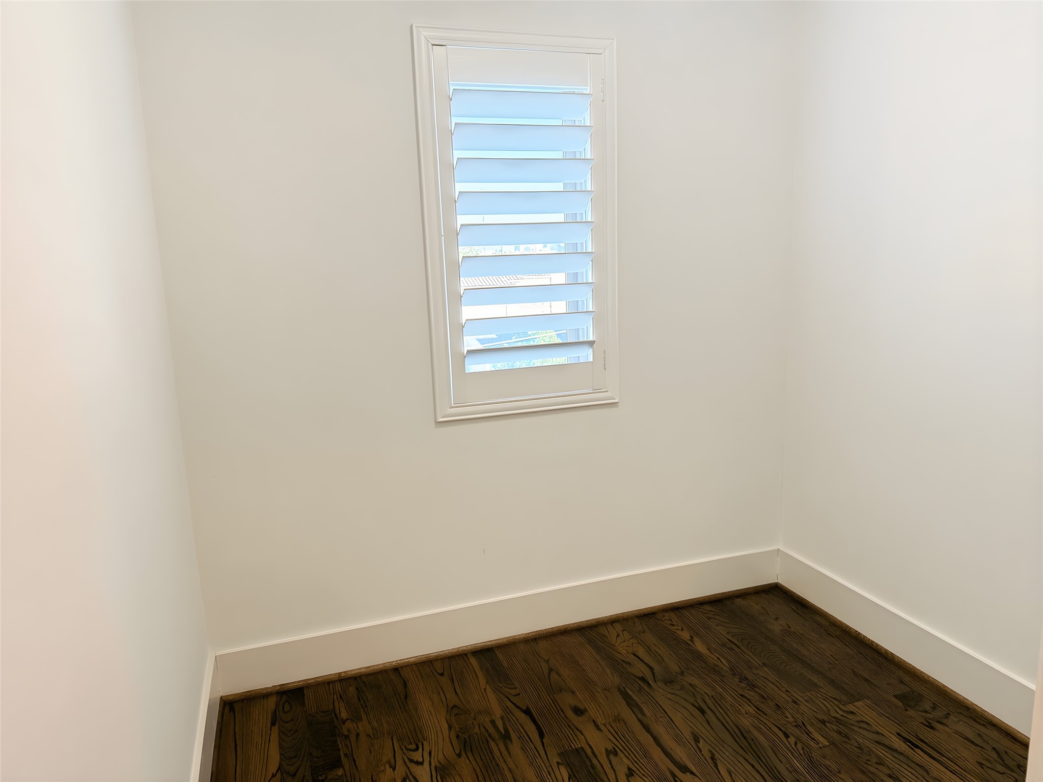 2115 Detering Street Houston, TX 77007 - Photo 28 of 30 a view of an empty room with wooden floor and a window