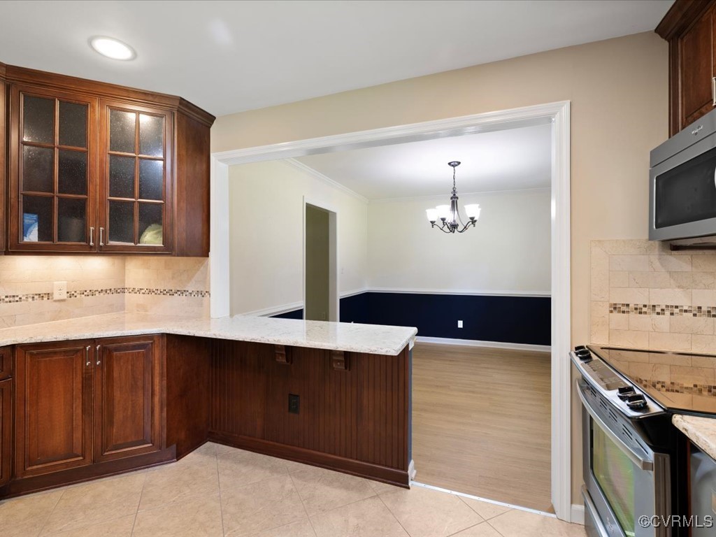 11311 Moravia Road Midlothian, VA 23112 - Photo 11 of 29 a kitchen with a sink appliances and cabinets
