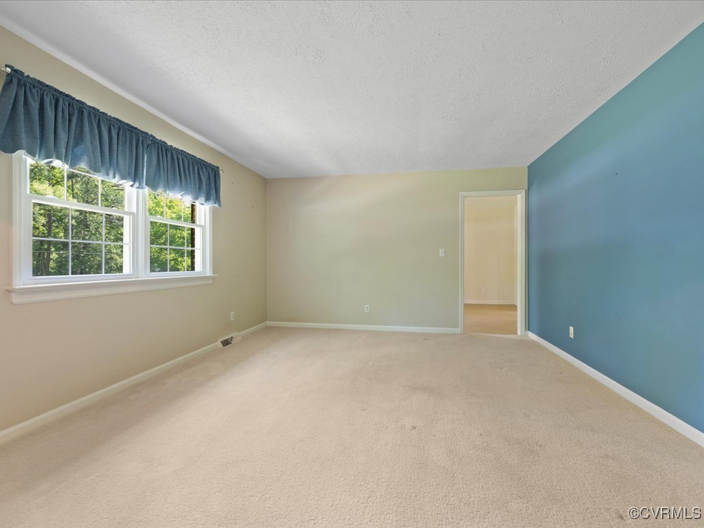 11311 Moravia Road Midlothian, VA 23112 - Photo 5 of 29 an empty room with a window