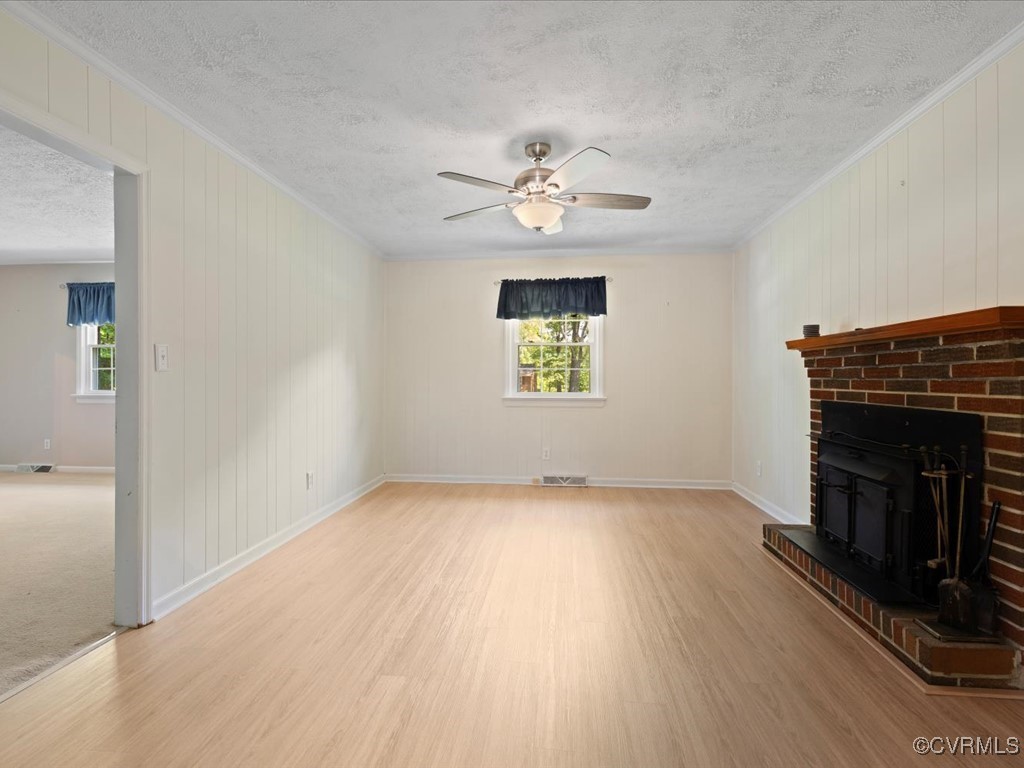 11311 Moravia Road Midlothian, VA 23112 - Photo 7 of 29 an empty room with windows and fireplace