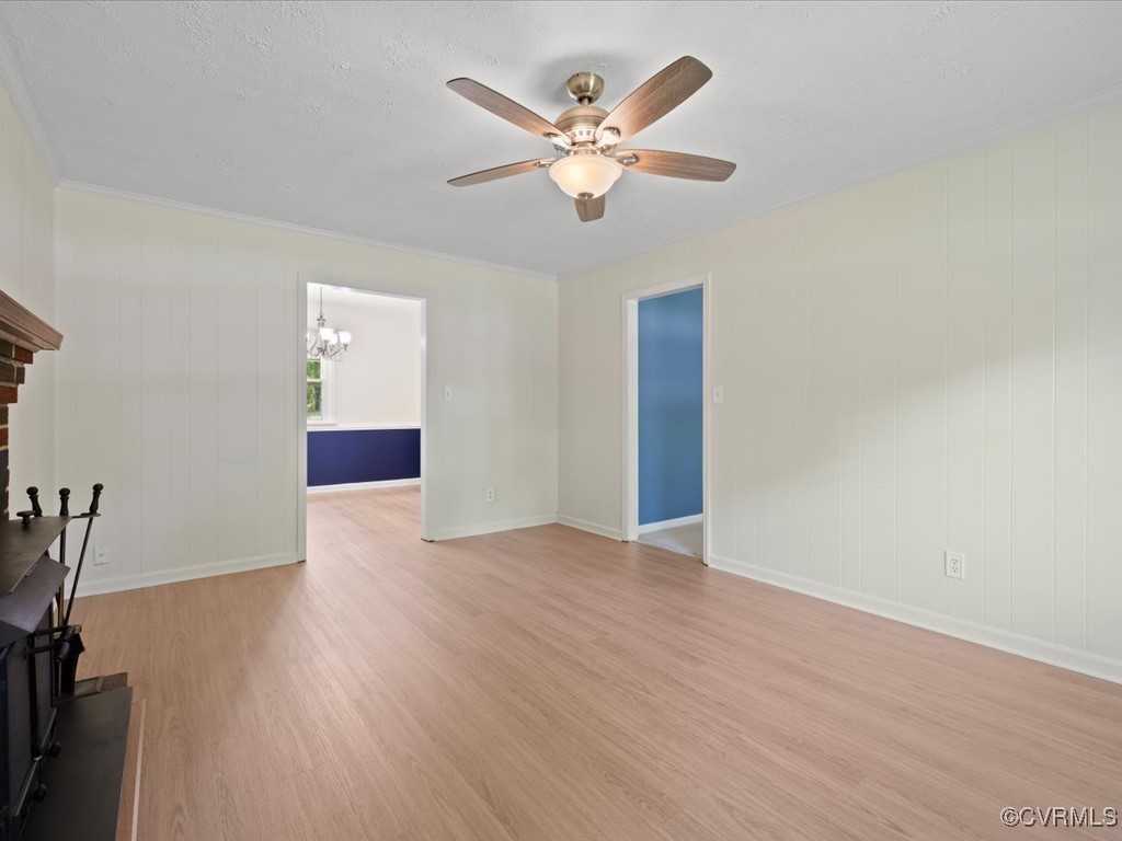 11311 Moravia Road Midlothian, VA 23112 - Photo 8 of 29 an empty room with wooden floor and ceiling fan