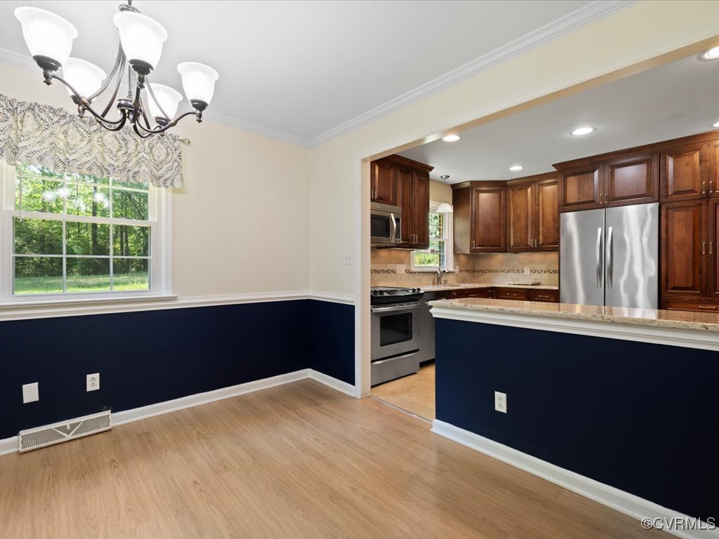 11311 Moravia Road Midlothian, VA 23112 - Photo 9 of 29 a kitchen with stainless steel appliances granite countertop a refrigerator and a sink