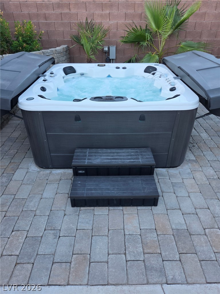 1072 Reed Point Court Henderson, NV 89002 - Photo 58 of 60 Relaxation awaits with this inviting spa, perfectly nestled on a paved patio for outdoor enjoyment.