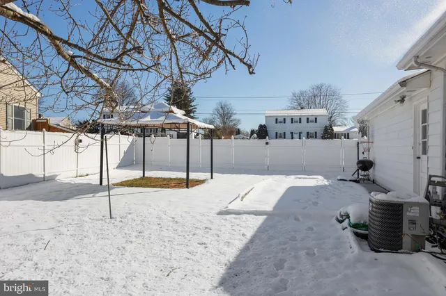 a view of a backyard of the house