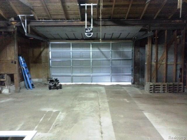 737 South Hospital Road Waterford, MI 48327 - Photo 38 of 41 Extra tall and wide door with opener... this is a mans man's space!