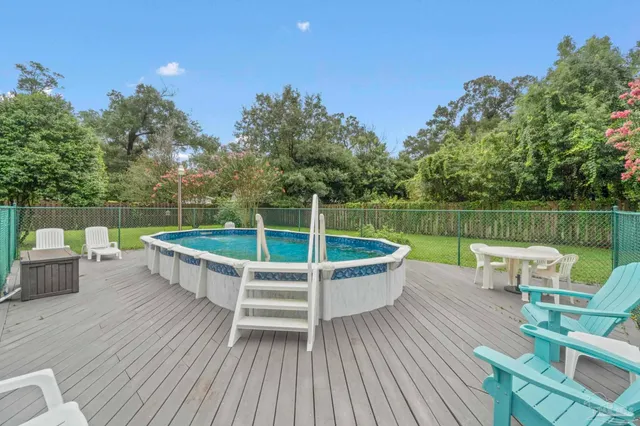a view of a chair and table on the wooden floor