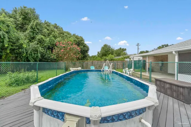a view of a swimming pool with a patio