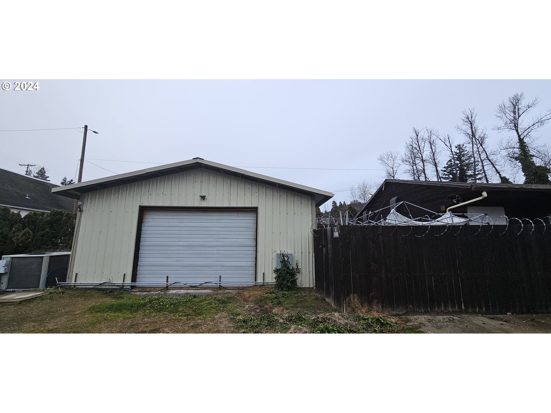 48197 Highway 58 Oakridge, OR 97463 - Photo 6 of 8 a front view of a house with a yard