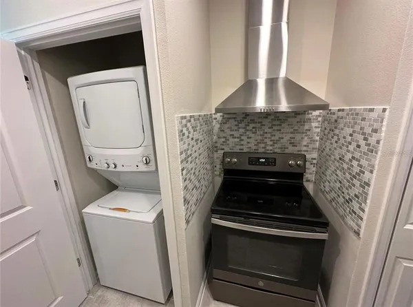 a kitchen with a stove and a microwave