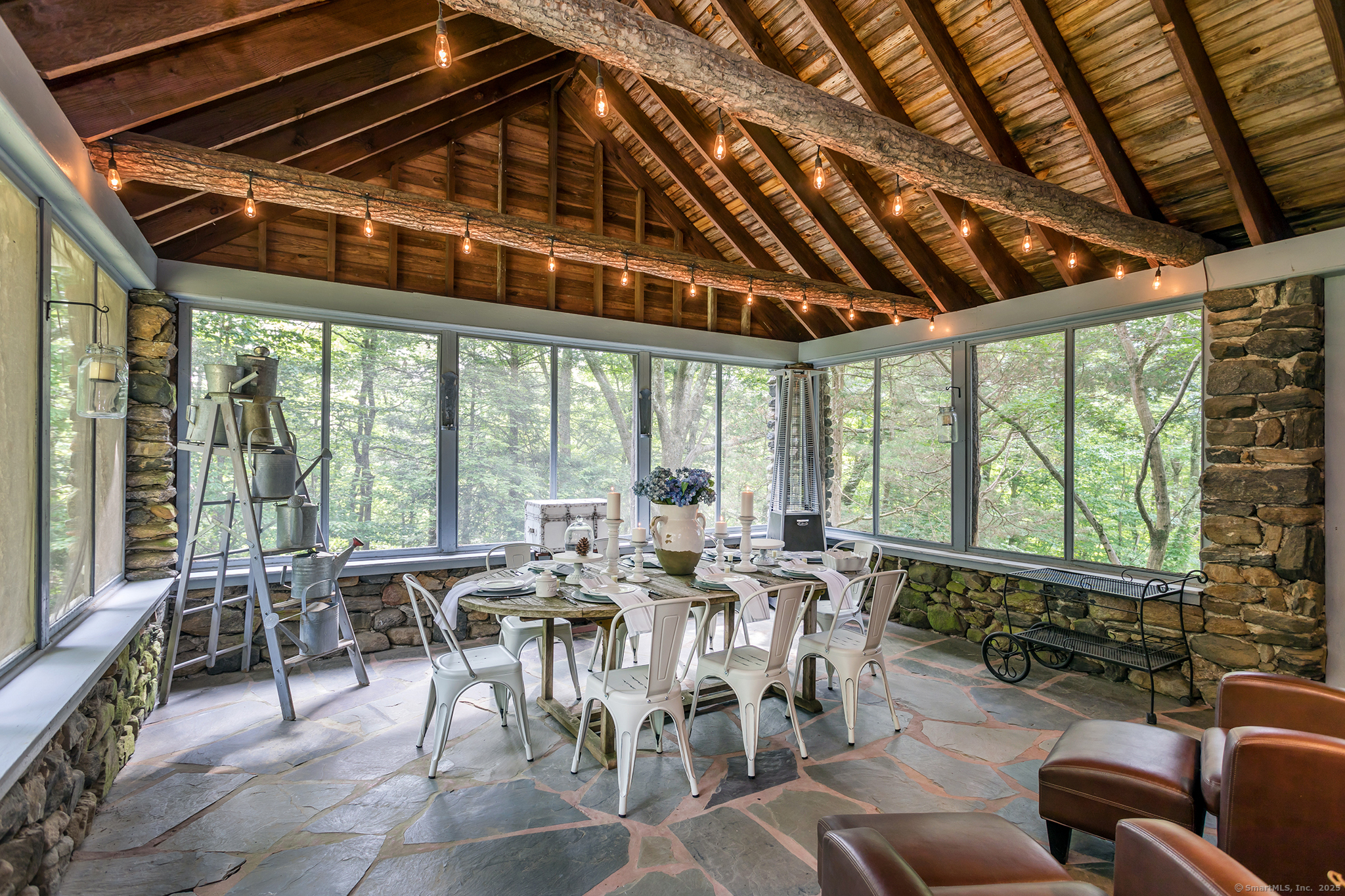 60 Leach Hollow Road Sherman, CT 06784 - Photo 10 of 24 a view of a dining room with furniture window and outside view