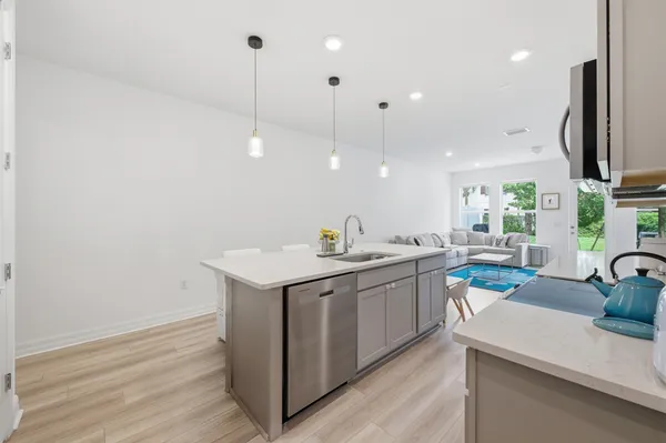 a kitchen with sink and microwave