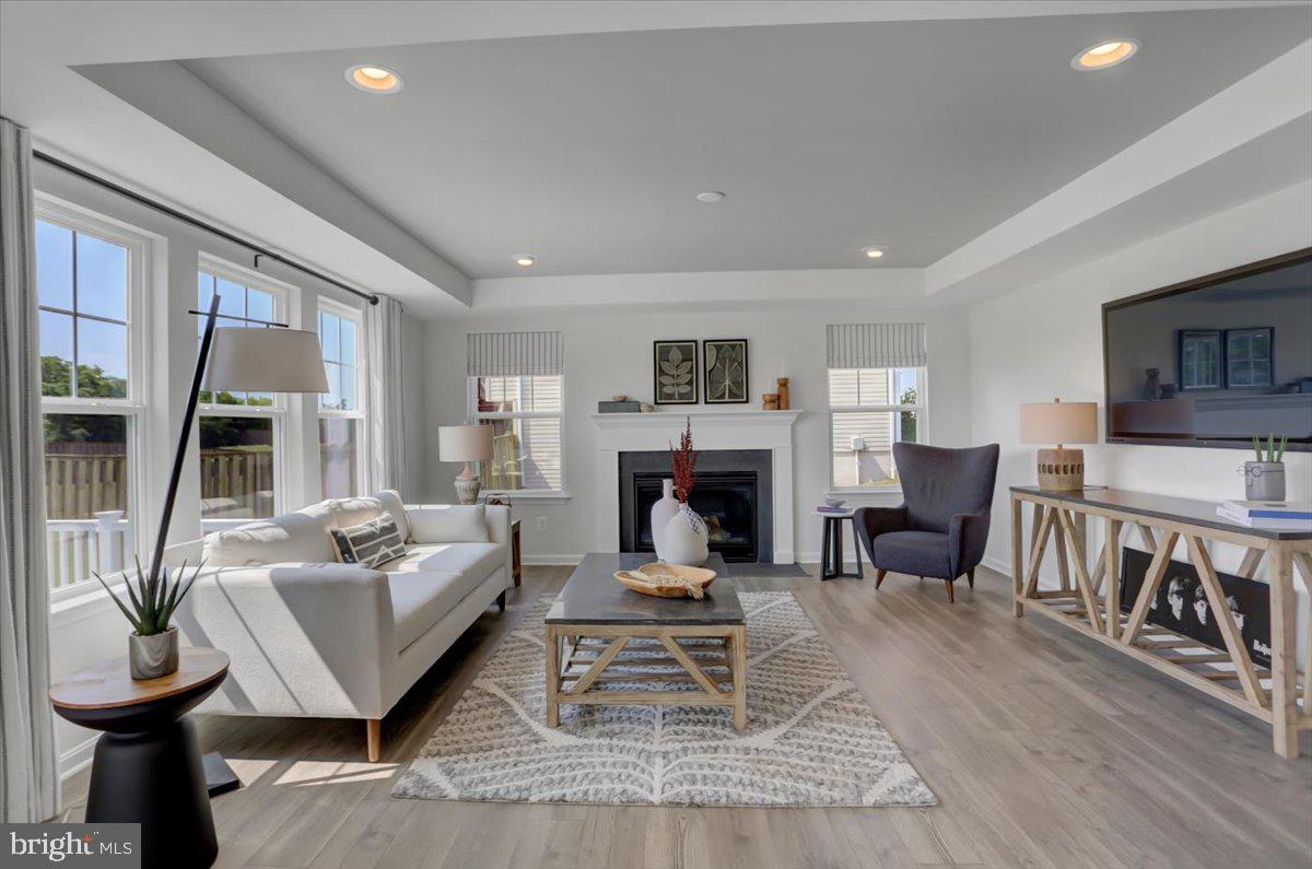 2115 B Nuttal Avenue Edgewood, MD 21040 - Photo 11 of 19 a living room with furniture a fireplace and a large window