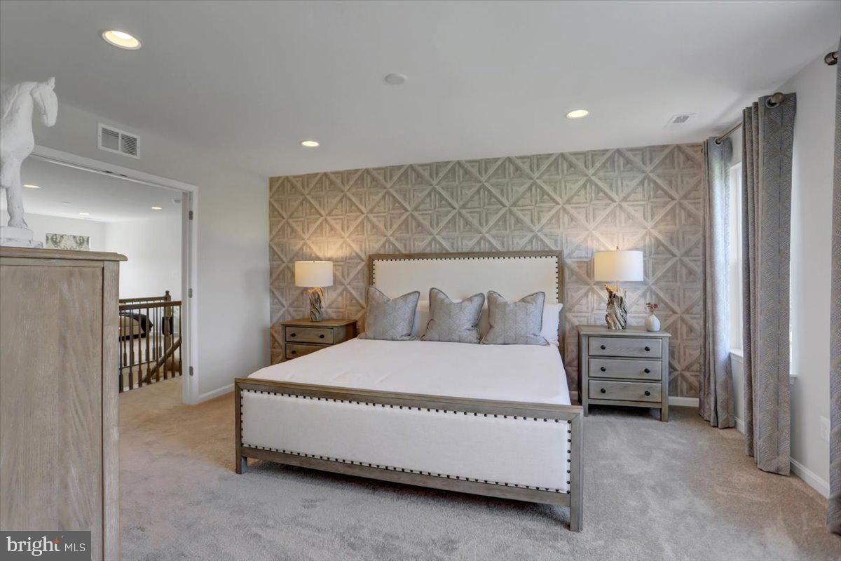 2115 B Nuttal Avenue Edgewood, MD 21040 - Photo 17 of 19 a spacious bedroom with a bed and a view of living room