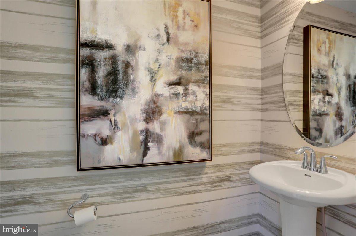 2115 B Nuttal Avenue Edgewood, MD 21040 - Photo 18 of 19 a bathroom with a sink and a mirror