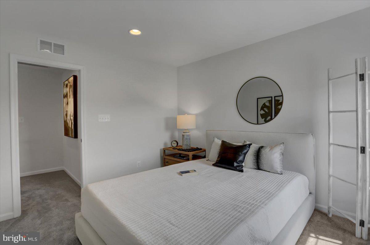 2115 B Nuttal Avenue Edgewood, MD 21040 - Photo 4 of 19 a bedroom with a bed and a lamp