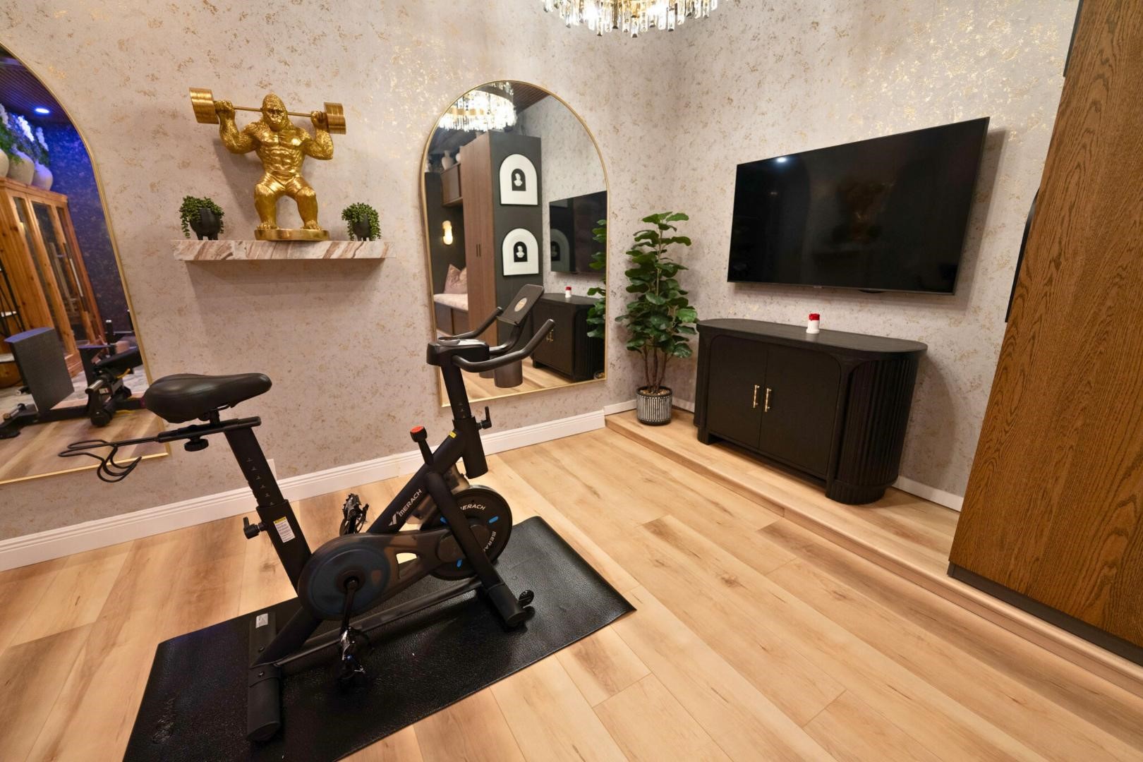 11347 Needlerock Court Humble, TX 77396 - Photo 16 of 20 a room with furniture and flat screen tv