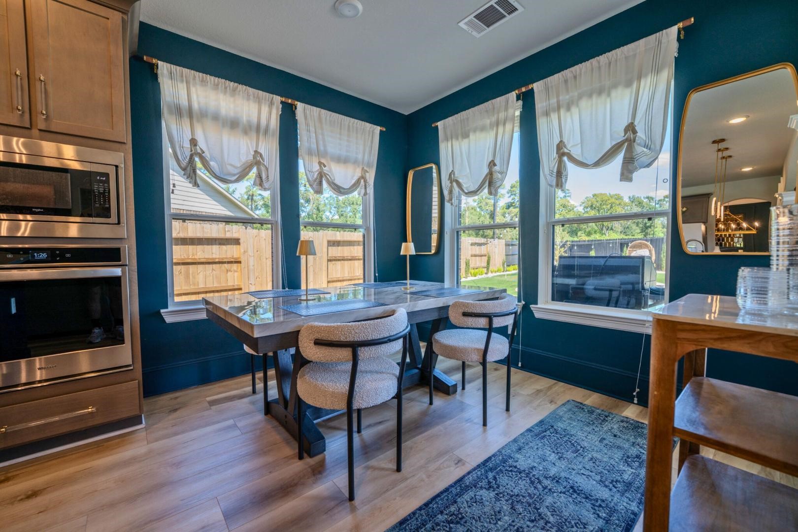 11347 Needlerock Court Humble, TX 77396 - Photo 9 of 20 a view of a dining room with furniture window and outside view