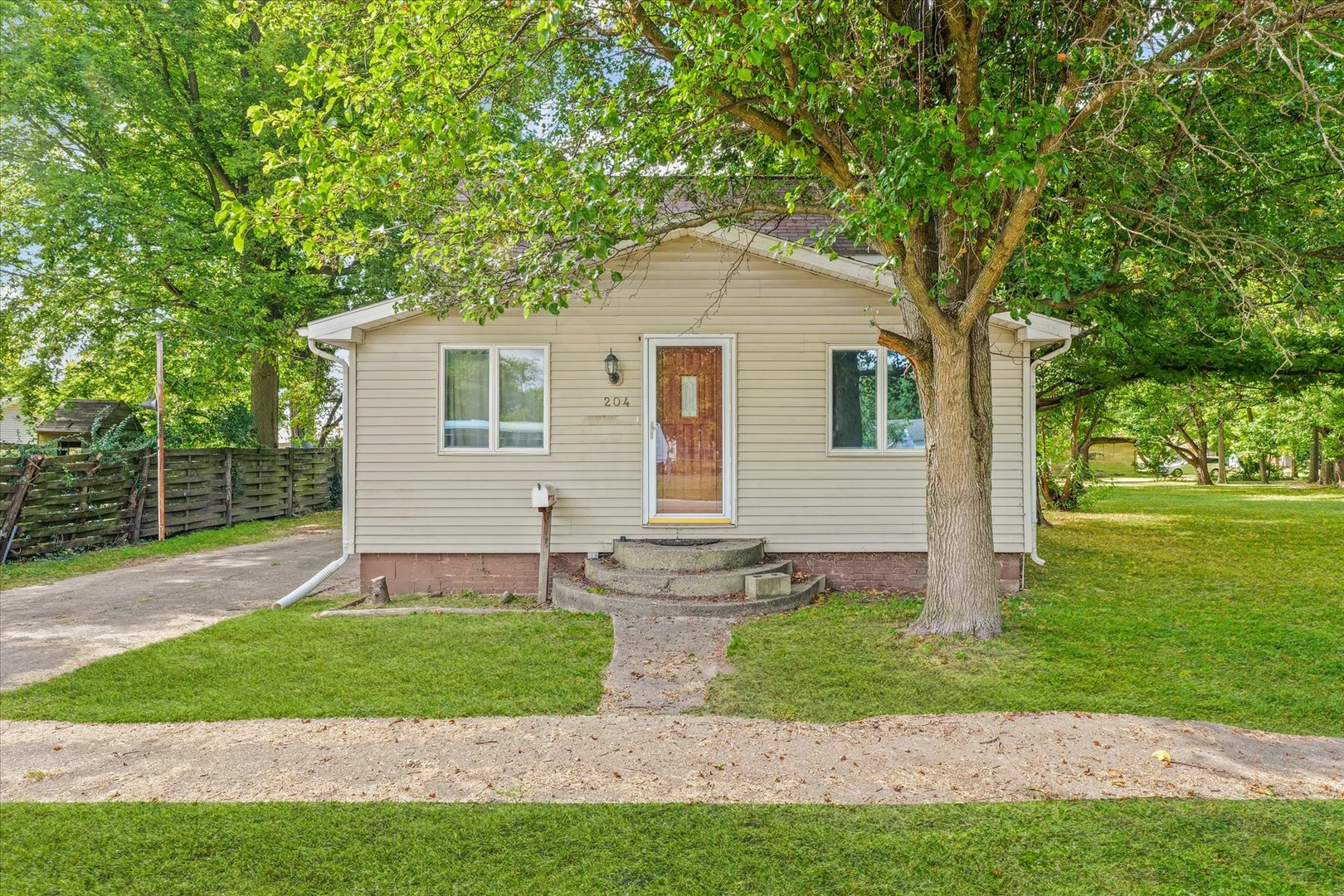 204 Waverly Street Homer, IL 61849 - Photo 1 of 30 a front view of a house with a yard