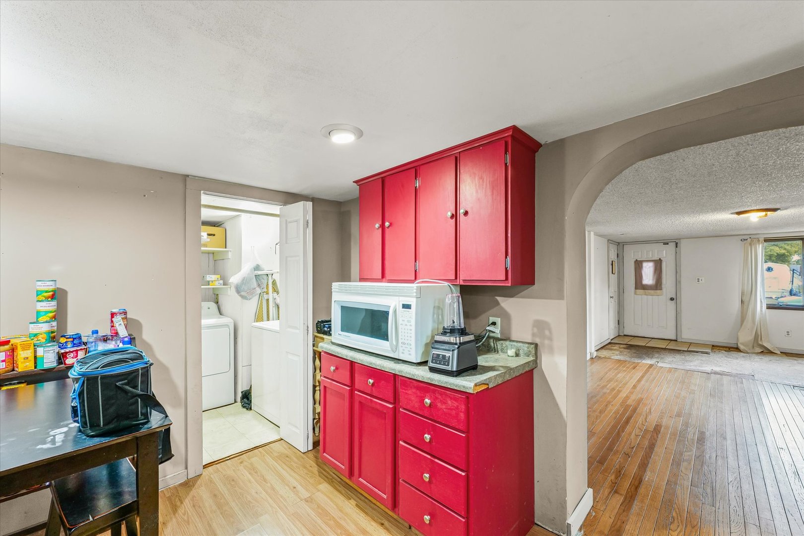 204 Waverly Street Homer, IL 61849 - Photo 12 of 30 a kitchen with stainless steel appliances granite countertop a stove a sink dishwasher and a refrigerator with wooden floor