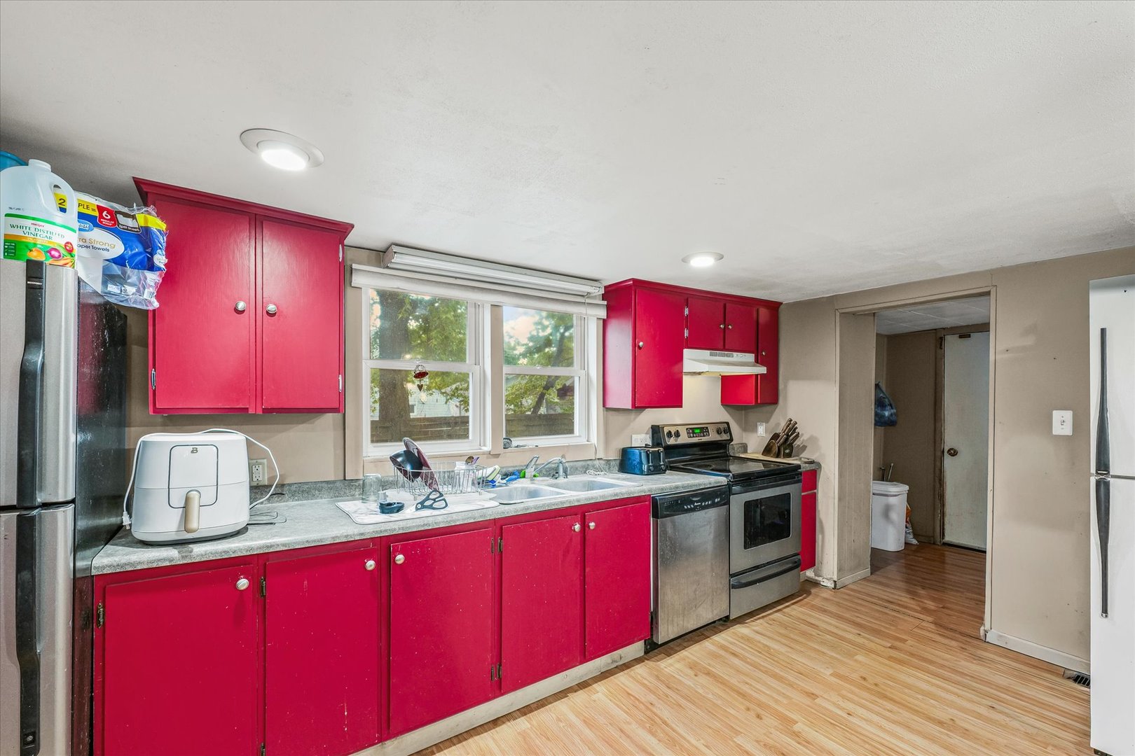 204 Waverly Street Homer, IL 61849 - Photo 13 of 30 a kitchen with a sink stove and refrigerator