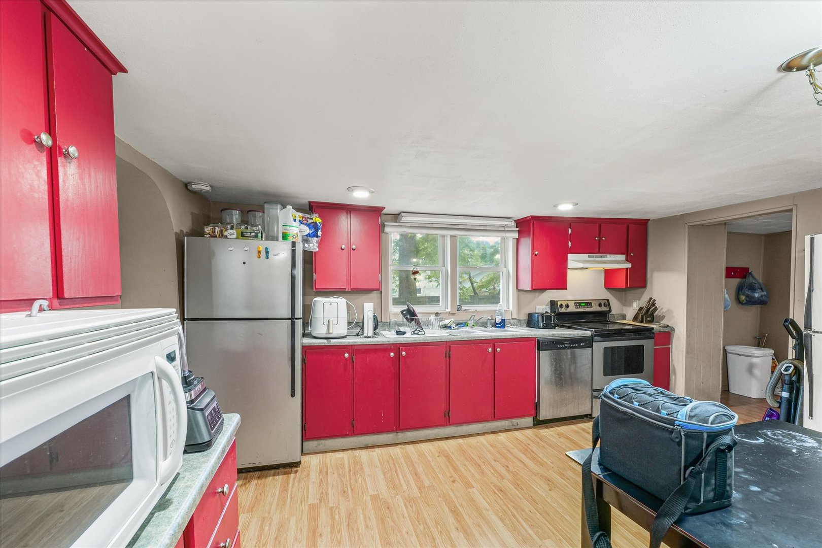 204 Waverly Street Homer, IL 61849 - Photo 14 of 30 a kitchen with refrigerator cabinets dining table and chairs