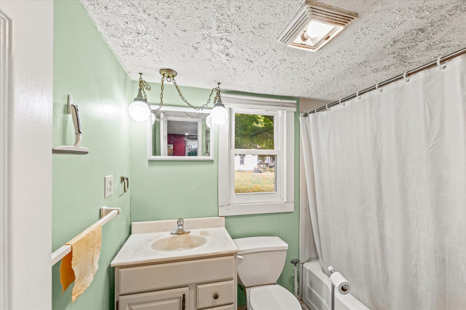 204 Waverly Street Homer, IL 61849 - Photo 16 of 30 a bathroom with a sink mirror and toilet