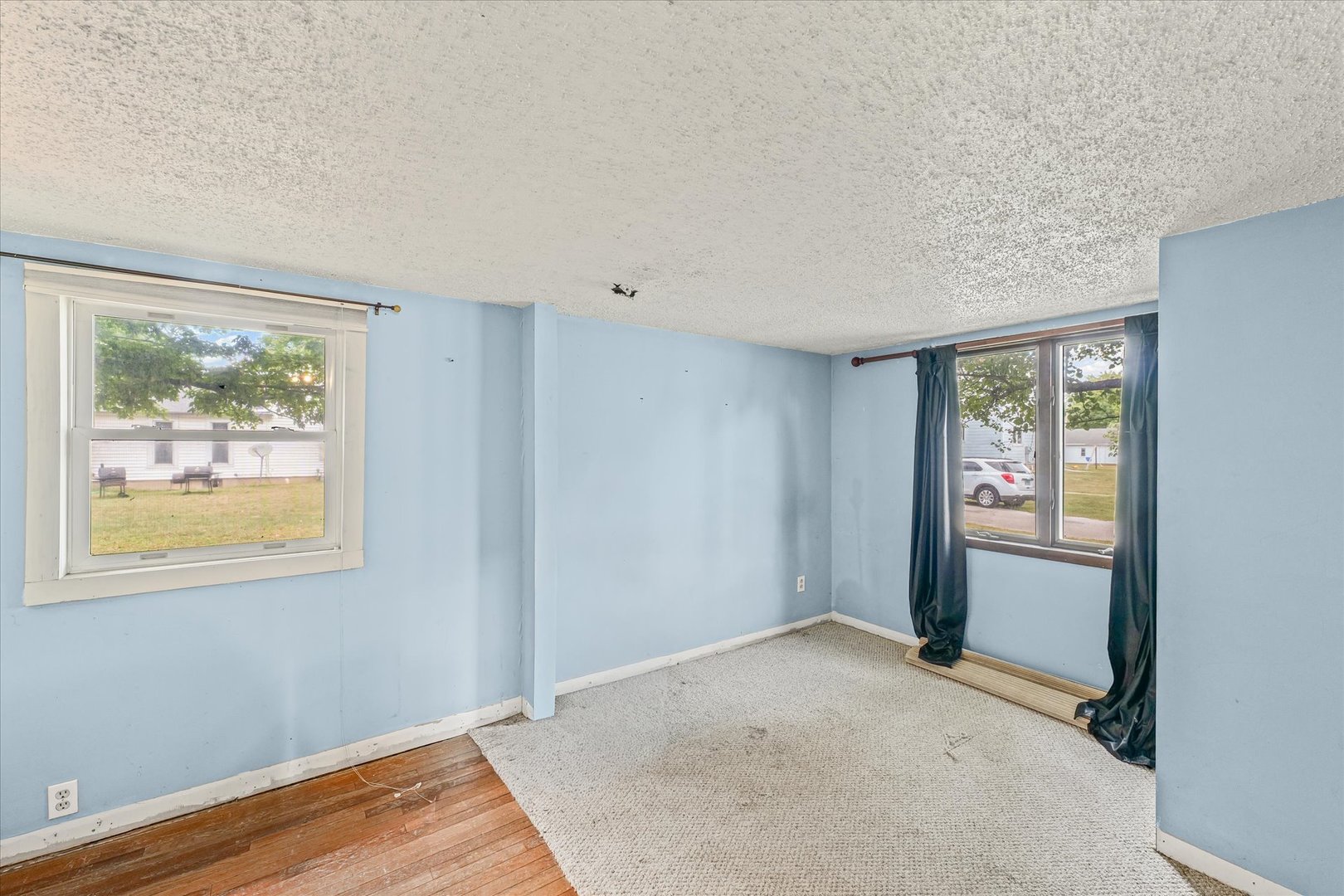 204 Waverly Street Homer, IL 61849 - Photo 20 of 30 a view of an empty room with window and wooden floor