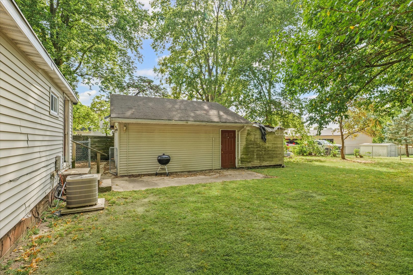 204 Waverly Street Homer, IL 61849 - Photo 26 of 30 a backyard of a house with table and chairs