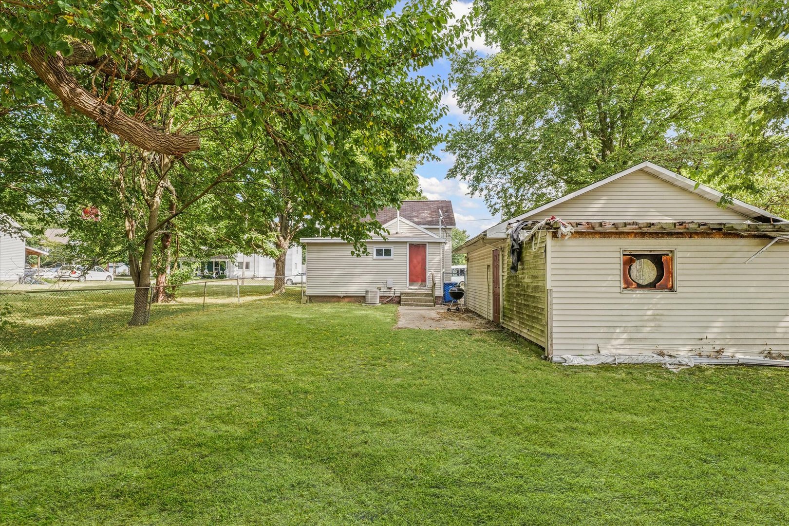 204 Waverly Street Homer, IL 61849 - Photo 29 of 30 a front view of a house with a yard and tree