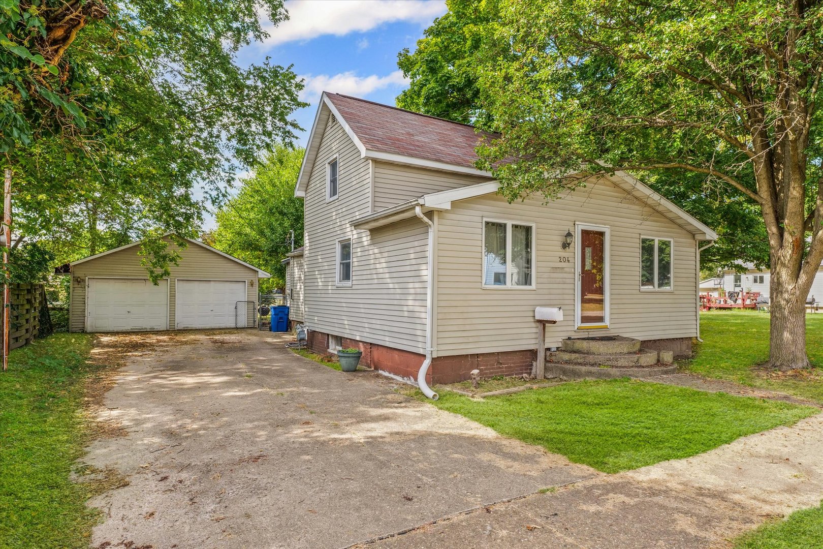 204 Waverly Street Homer, IL 61849 - Photo 3 of 30 a view of a house with a yard and large tree
