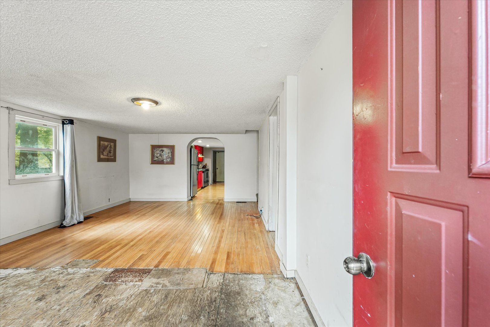 204 Waverly Street Homer, IL 61849 - Photo 5 of 30 a view of a livingroom with wooden floor and a window