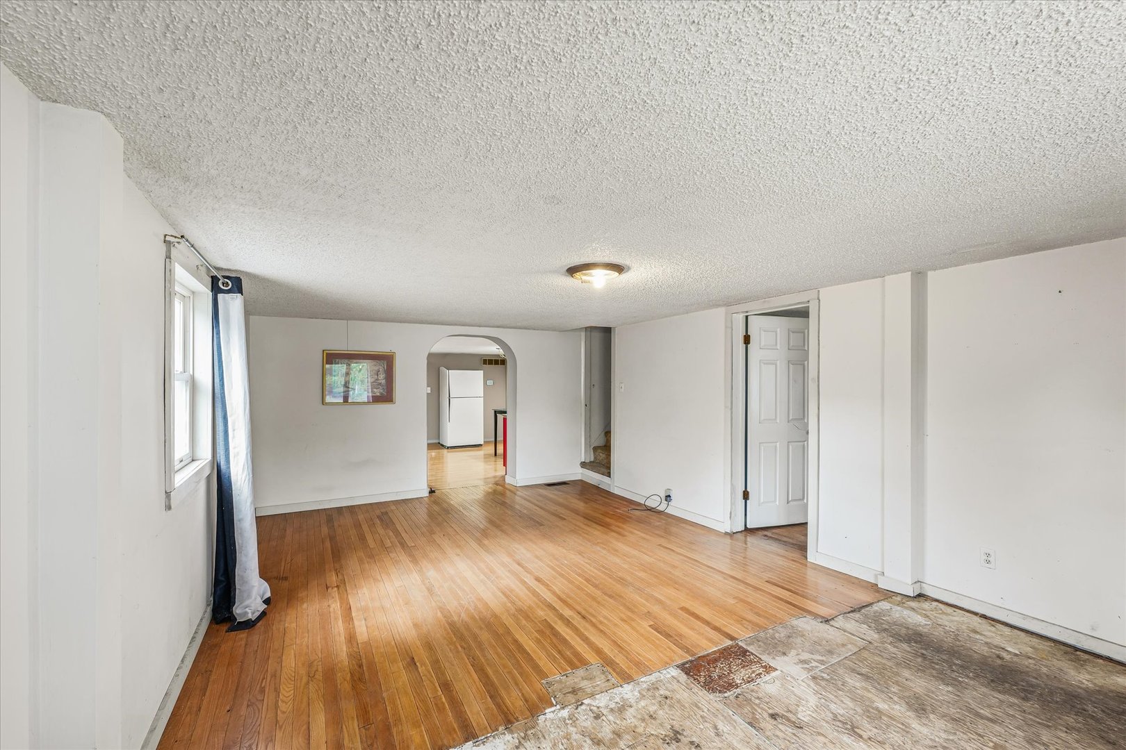 204 Waverly Street Homer, IL 61849 - Photo 6 of 30 a view of an empty room with wooden floor