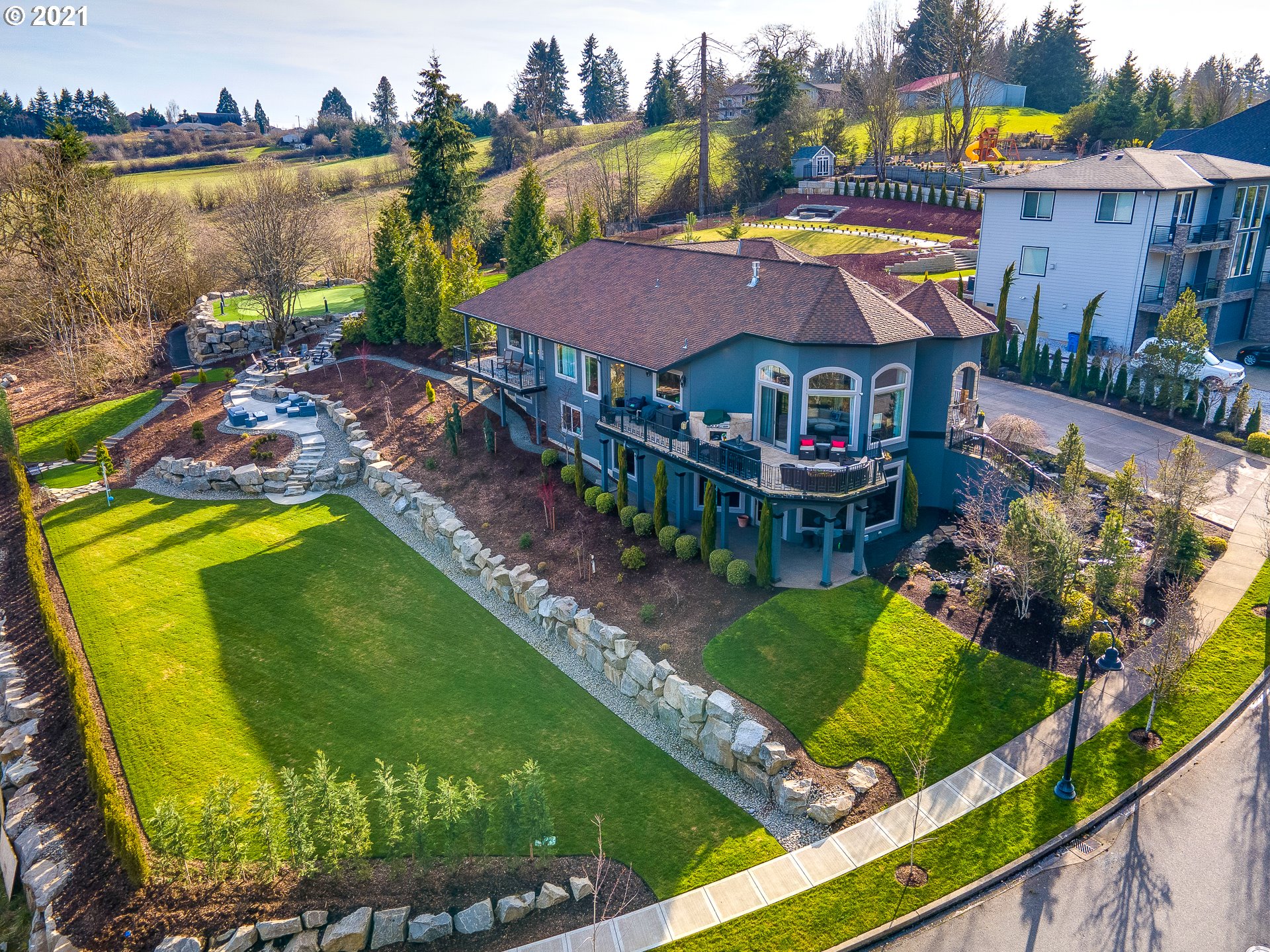 1711 South 8th Way Ridgefield, WA 98642 - Photo 2 of 28 a view of a house with a garden and a sitting area