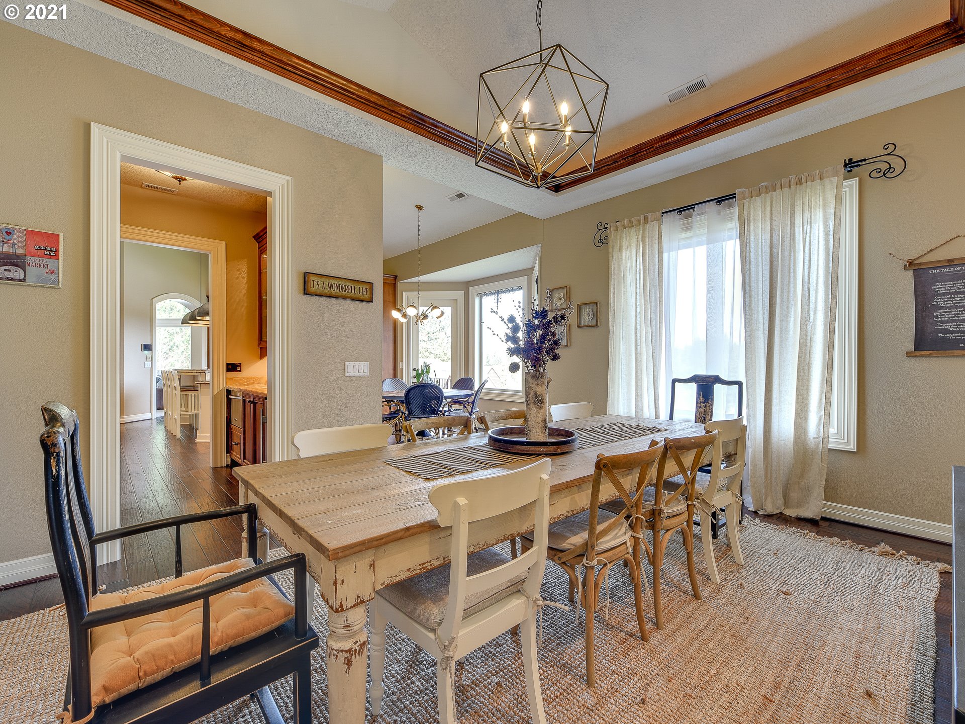 1711 South 8th Way Ridgefield, WA 98642 - Photo 12 of 28 a view of a dining room with furniture window and wooden floor