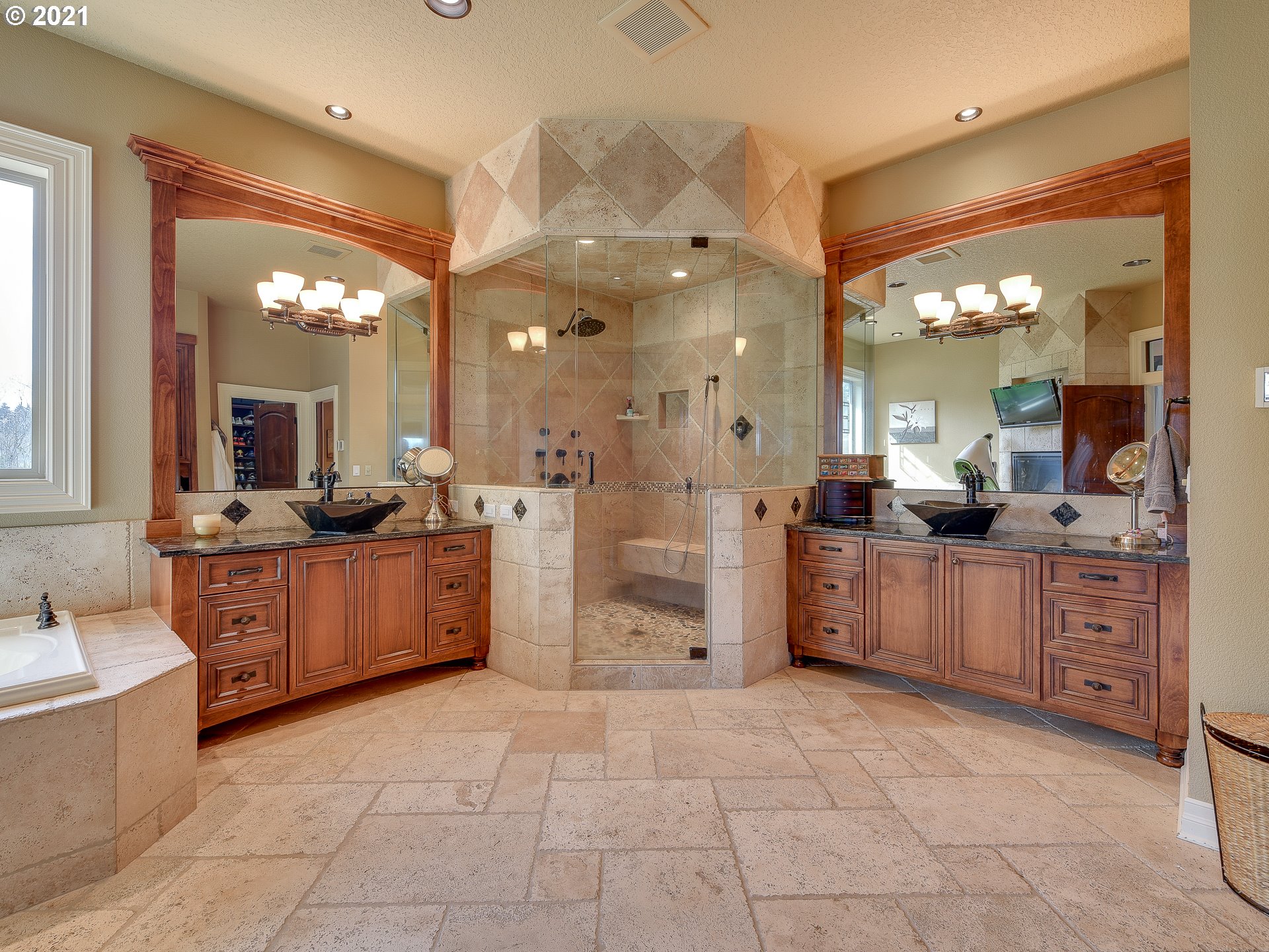 1711 South 8th Way Ridgefield, WA 98642 - Photo 17 of 28 a large bathroom with a large tub sink vanity and mirror