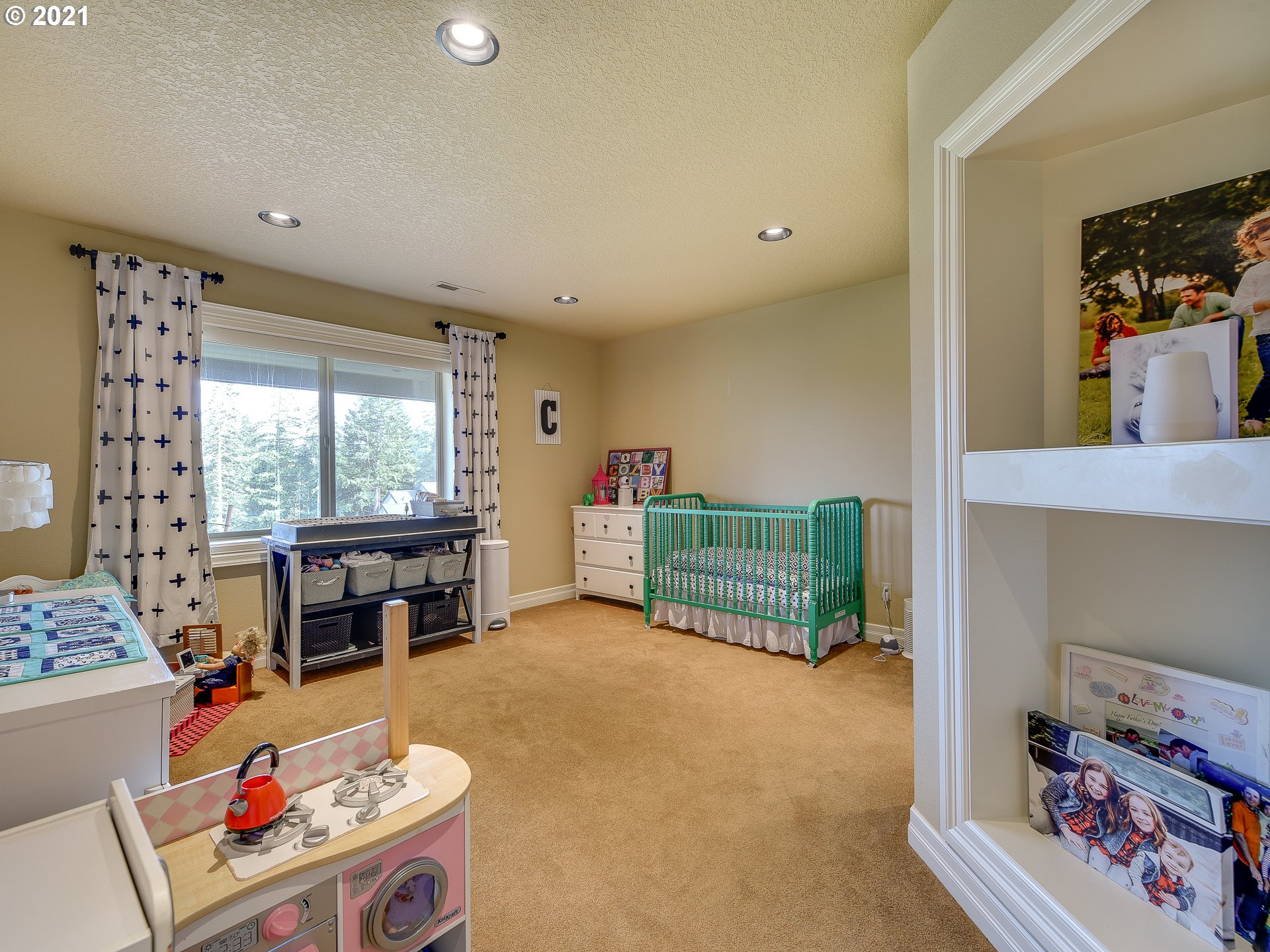 1711 South 8th Way Ridgefield, WA 98642 - Photo 20 of 28 a living room with furniture and a floor to ceiling window