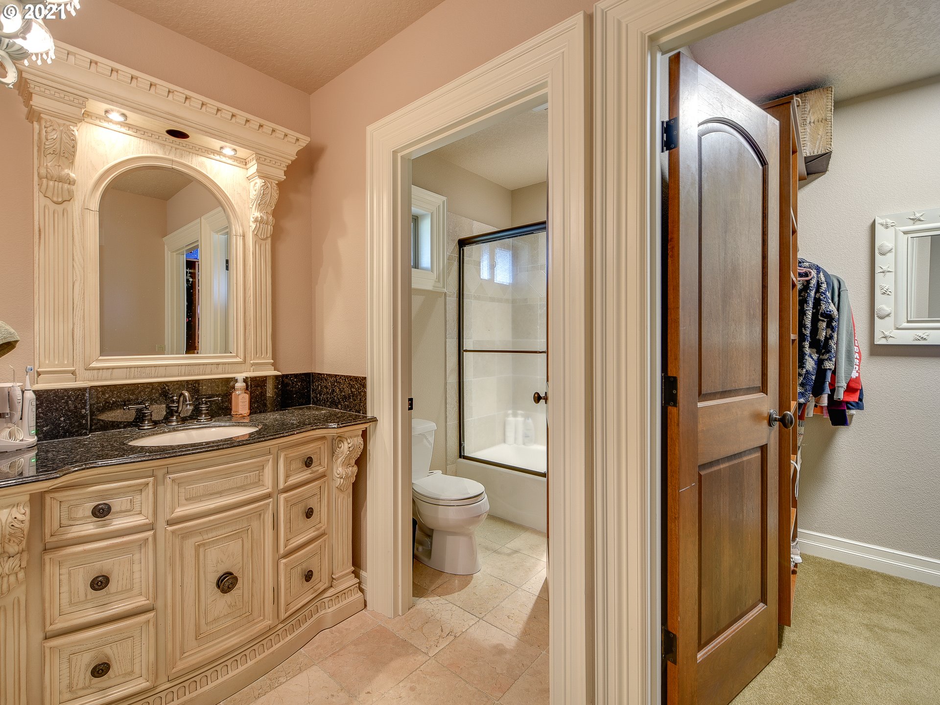 1711 South 8th Way Ridgefield, WA 98642 - Photo 23 of 28 a spacious bathroom with a granite countertop sink mirror and a toilet