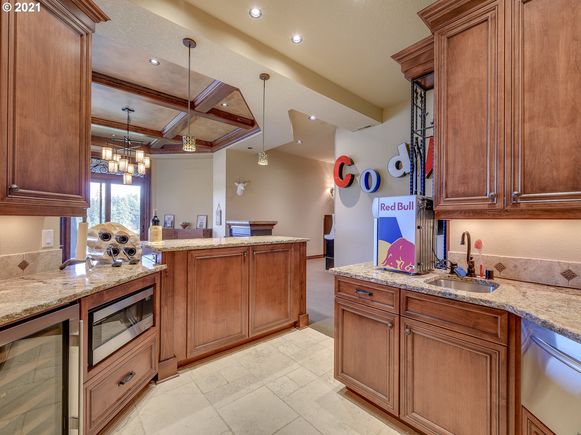 1711 South 8th Way Ridgefield, WA 98642 - Photo 27 of 28 a kitchen with a sink stove and cabinets