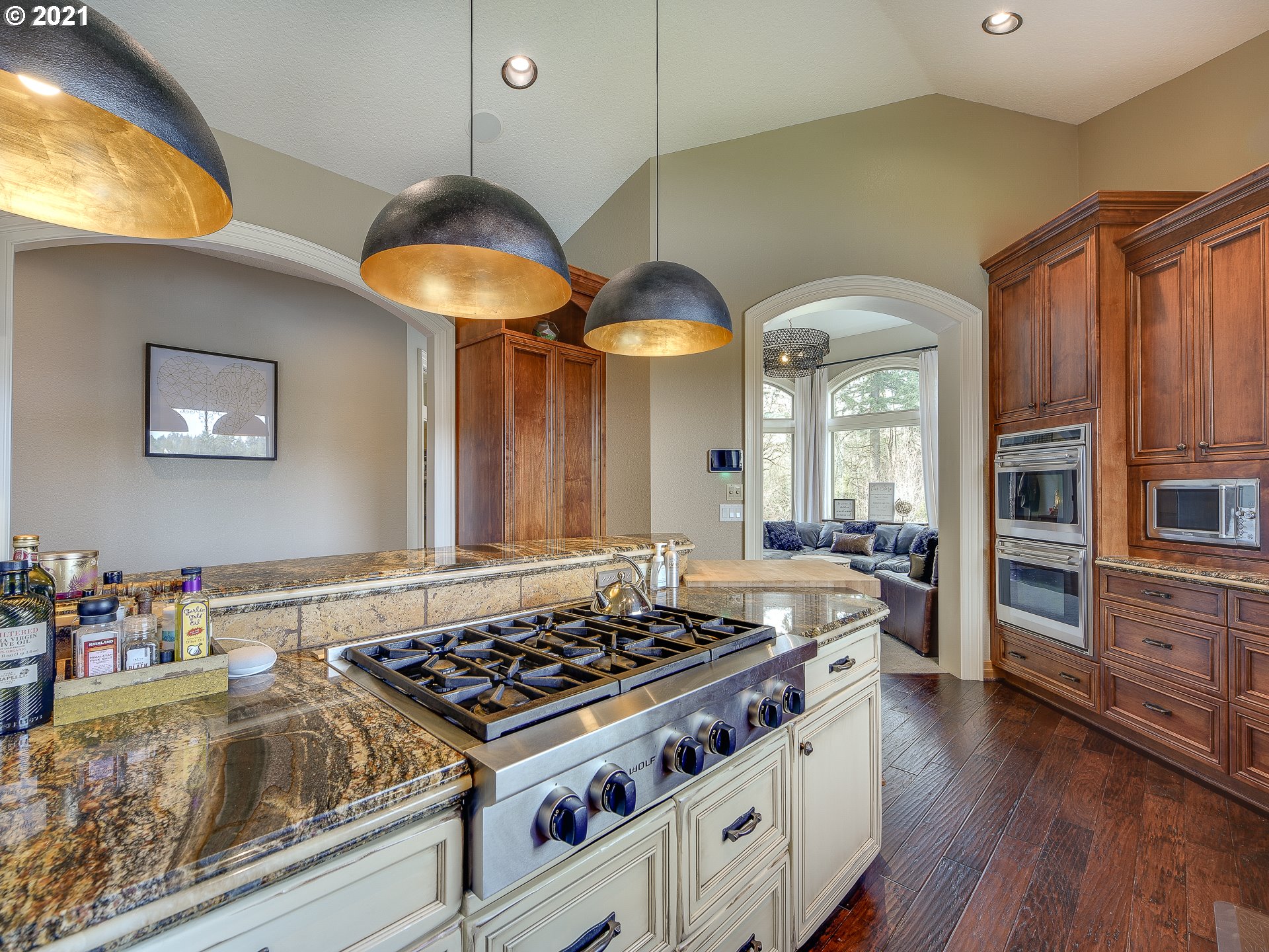 1711 South 8th Way Ridgefield, WA 98642 - Photo 9 of 28 a kitchen with stove and wooden floor