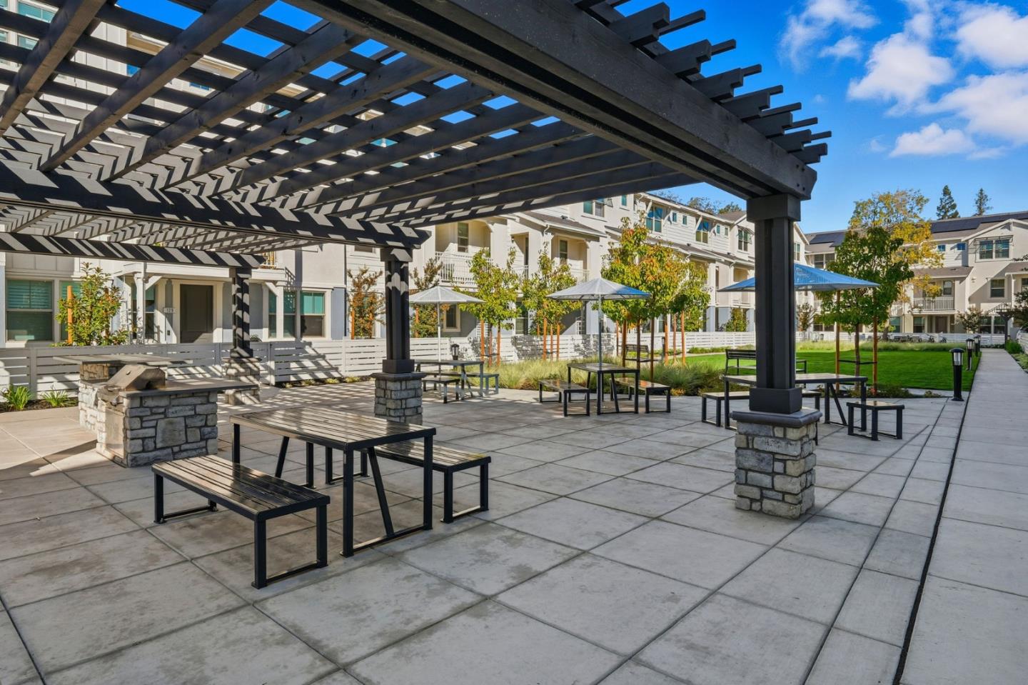 184 Oak Circle Walnut Creek, CA 94597 - Photo 23 of 24 a view of a patio with a dining table and chairs with a large tree