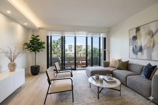 a living room with furniture and a large window with outer view